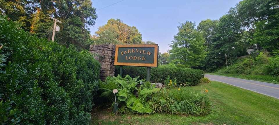 Stone entrance sign at the lodge driveway